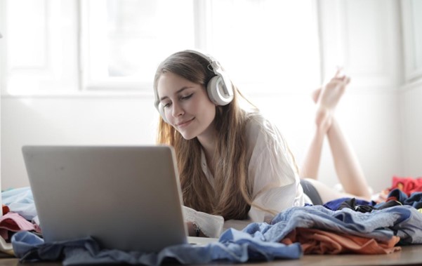 A woman is enjoying her time listening to music.